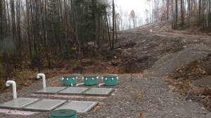 An Rv Dump Station Utilizing Secondary Treatment Prior To Mound System At The Top Of The Hill