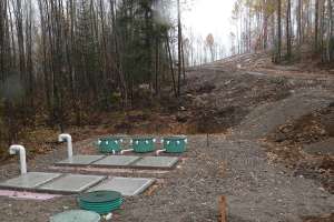 An Rv Dump Station Utilizing Secondary Treatment Prior To Mound System At The Top Of The Hill